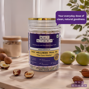 Jar of Nut Story Daily Wellness Trail Mix on a wooden surface with nuts and apples around